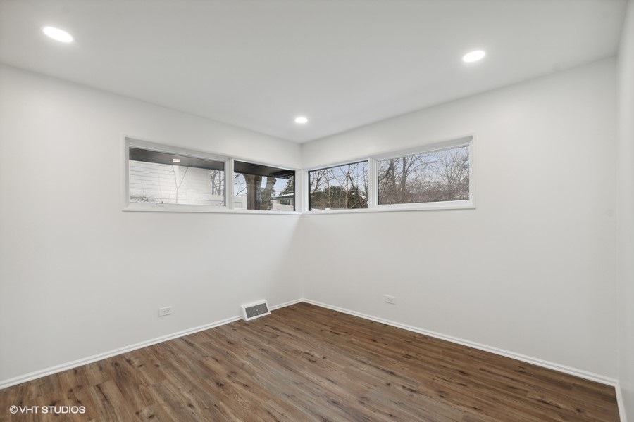1232 Warrington Road Deerfield, IL 60015 - Photo 10 of 17 a view of wooden floor and windows in a room