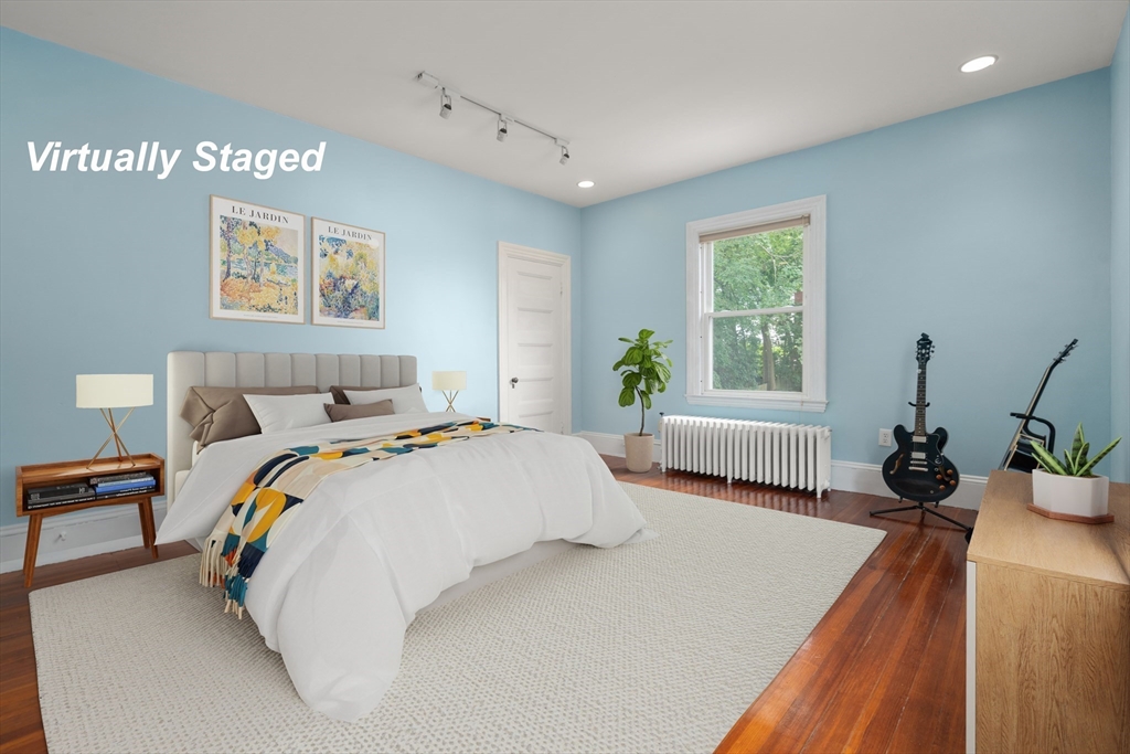 12 Zamora Street Boston, MA 02130 - Photo 14 of 28 a bedroom with bed and a window