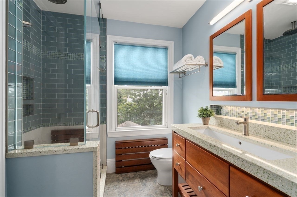 12 Zamora Street Boston, MA 02130 - Photo 15 of 28 a bathroom with a granite countertop sink toilet and shower