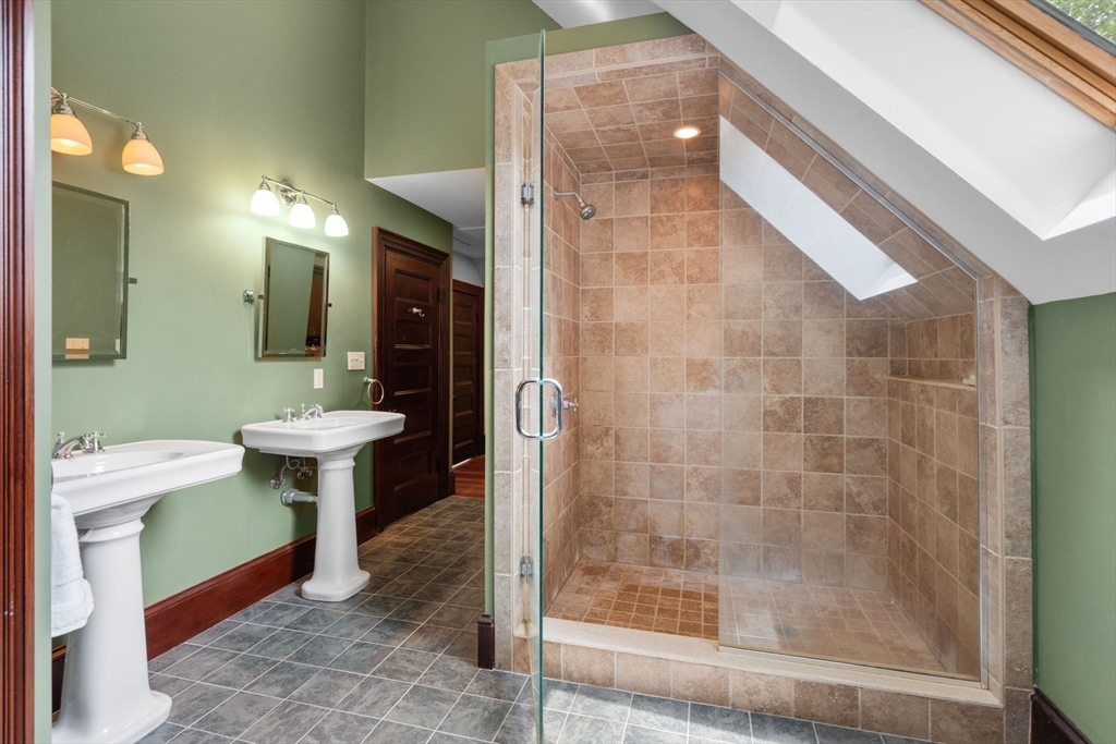 12 Zamora Street Boston, MA 02130 - Photo 19 of 28 a bathroom with a sink and a mirror