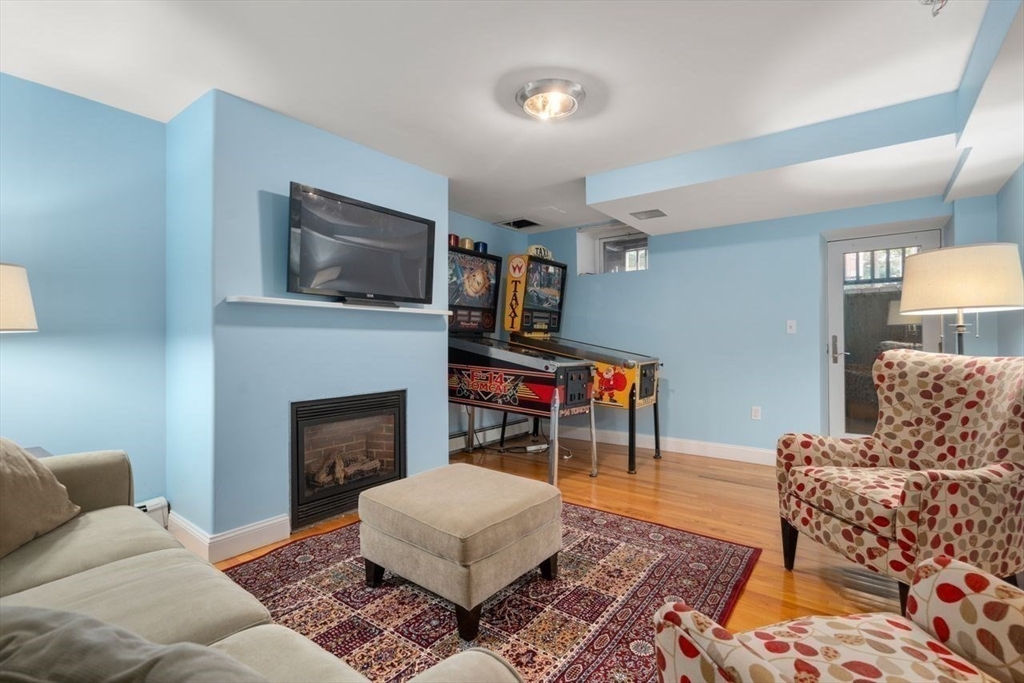 12 Zamora Street Boston, MA 02130 - Photo 22 of 28 a living room with furniture and a fireplace