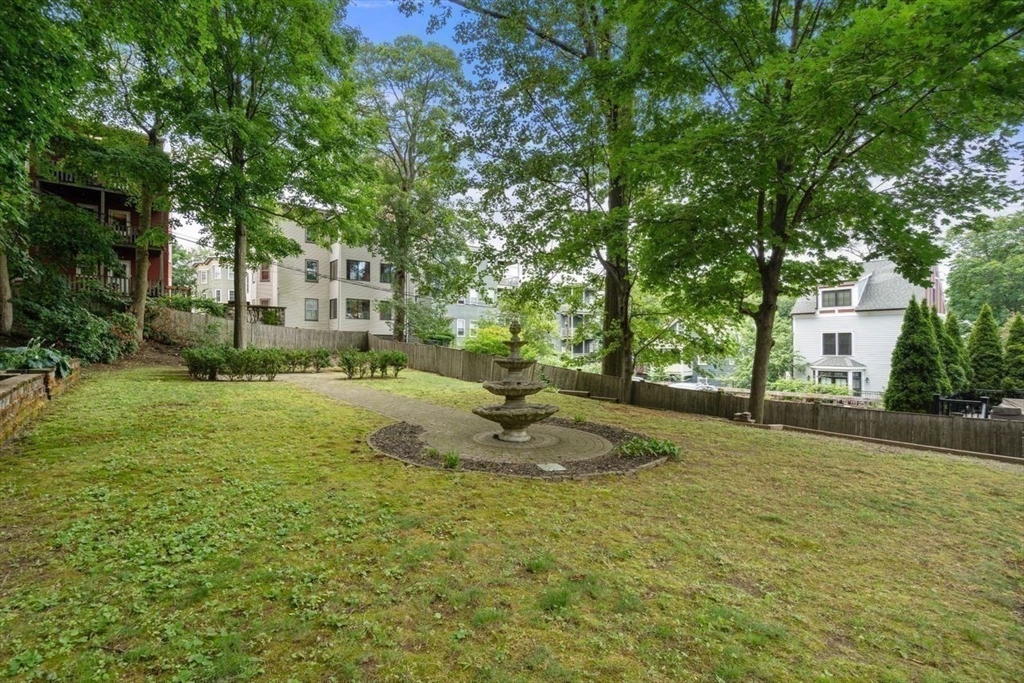 12 Zamora Street Boston, MA 02130 - Photo 27 of 28 a view of a playground with a house and trees in the background