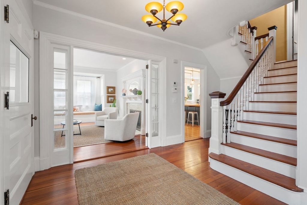 12 Zamora Street Boston, MA 02130 - Photo 3 of 28 a living room with furniture and a chandelier