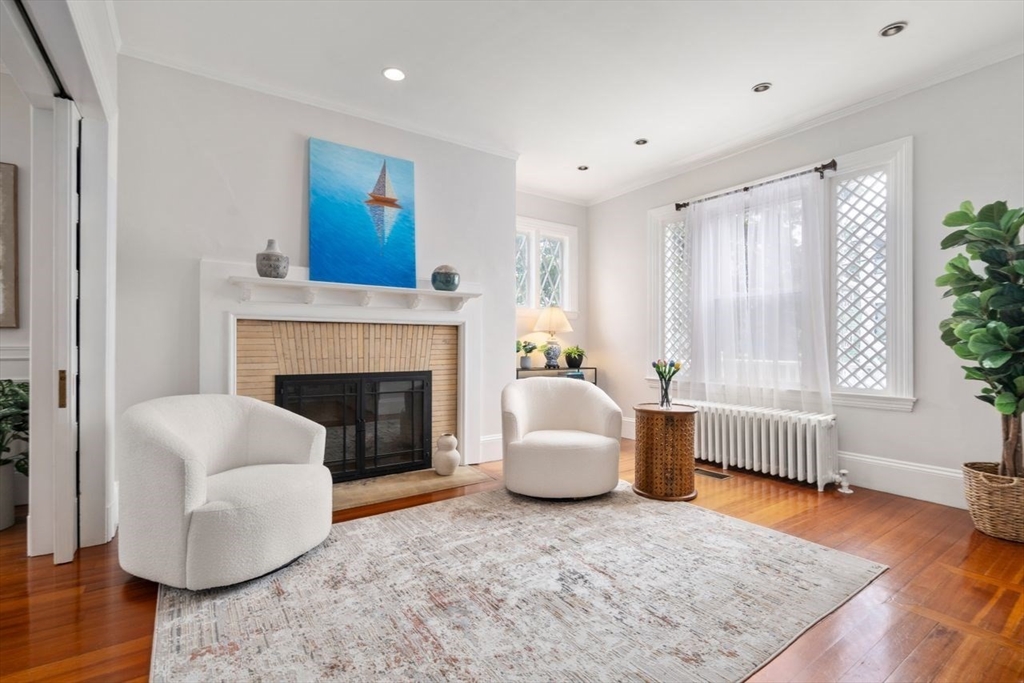 12 Zamora Street Boston, MA 02130 - Photo 6 of 28 a living room with furniture and a fireplace