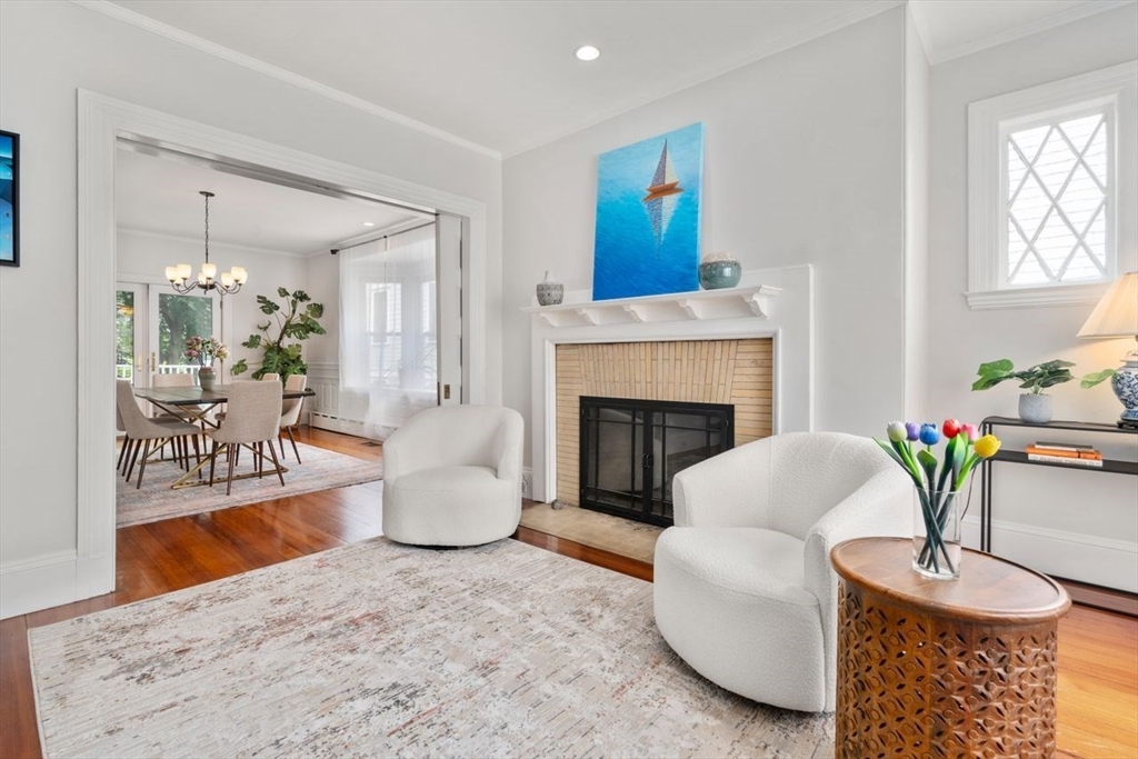 12 Zamora Street Boston, MA 02130 - Photo 7 of 28 a living room with furniture and a fireplace