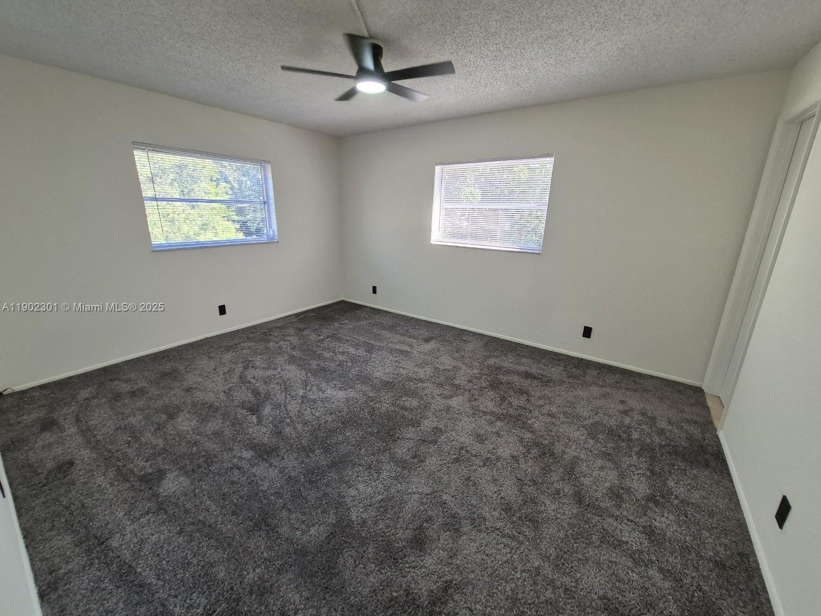 5100 Southwest 64th Avenue, Unit 201A Davie, FL 33314 - Photo 18 of 29 a view of an empty room with a window