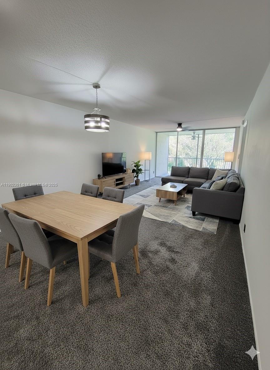 5100 Southwest 64th Avenue, Unit 201A Davie, FL 33314 - Photo 2 of 29 a view of a dining room with furniture