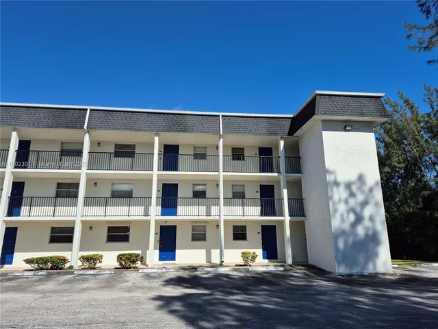 a front view of a building with street view