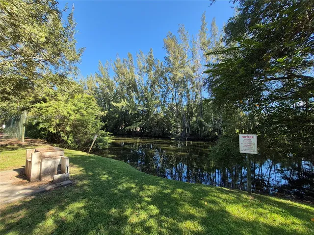 a view of a house with swimming pool and sitting area