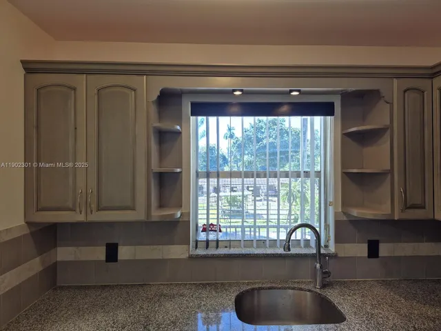 a bathroom with a sink a mirror and a bathtub