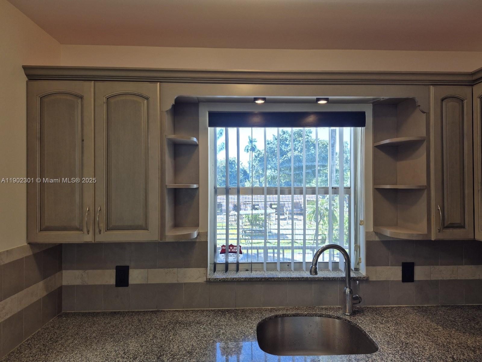5100 Southwest 64th Avenue, Unit 201A Davie, FL 33314 - Photo 8 of 29 a bathroom with a sink a mirror and a bathtub