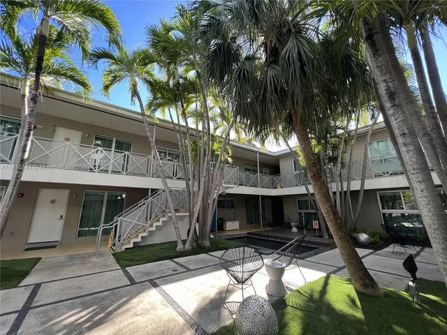 a view of house with a tree in front