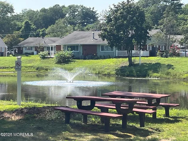 a view of a lake with houses in the background