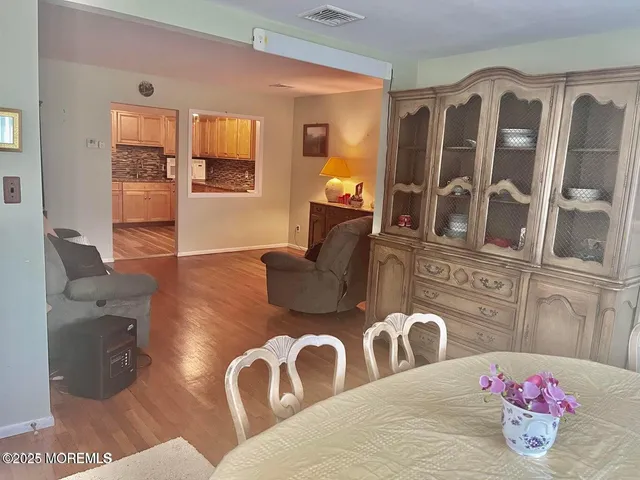 a kitchen with stainless steel appliances granite countertop a refrigerator a stove and a sink with granite countertops