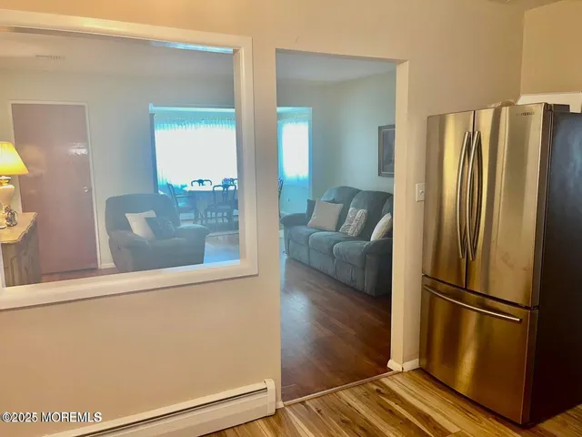 a kitchen with a stove sink and cabinets