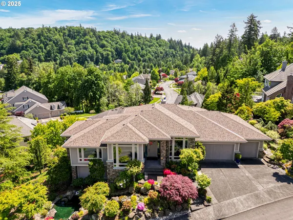 a view of a house with a lot of flower plants