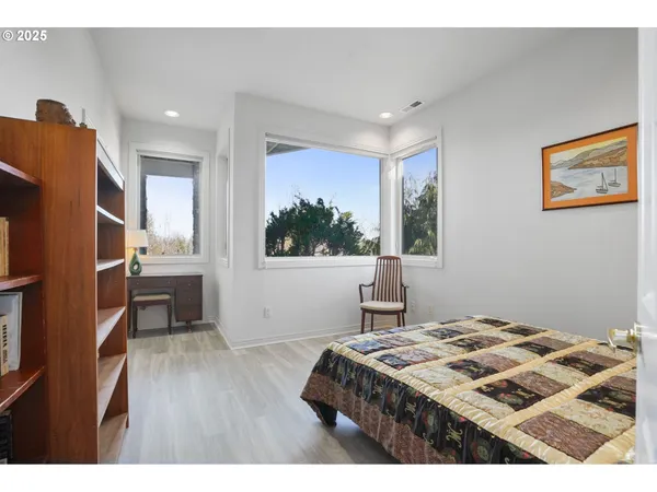 a bedroom with a bed and a table in it