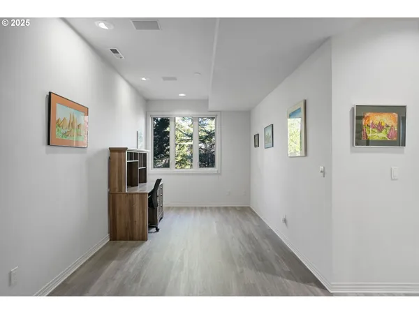 a view of kitchen with window and wooden floor