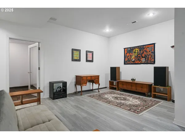 a living room with furniture and a rug
