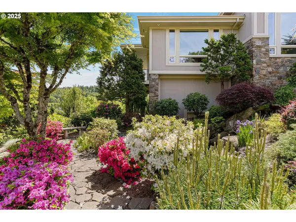 a view of a house with a flower garden