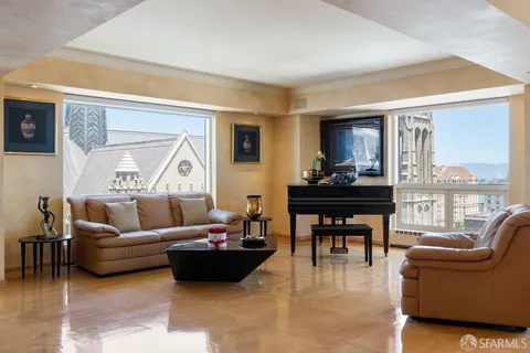 a view of a hallway with dining room and wooden floor