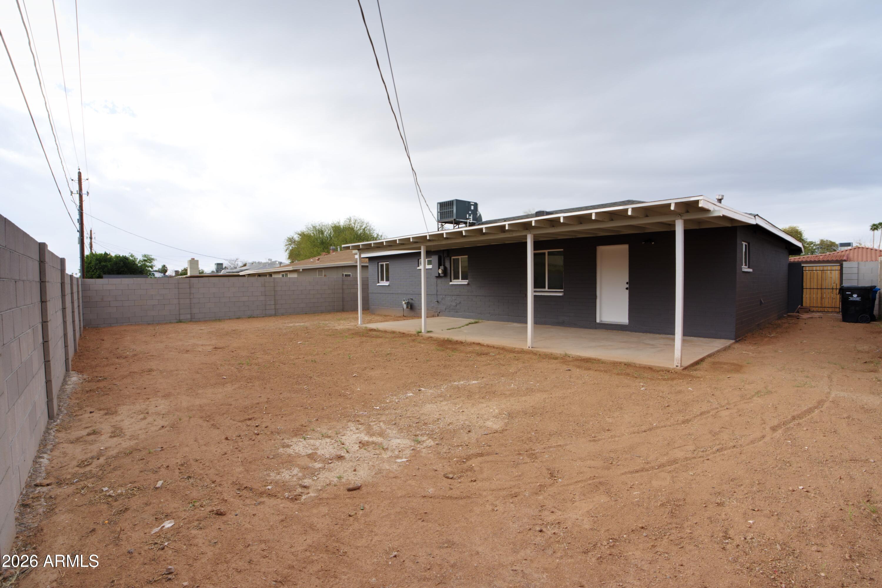 4437 East Almeria Road Phoenix, AZ 85008 - Photo 20 of 20 a backyard of a house with large trees