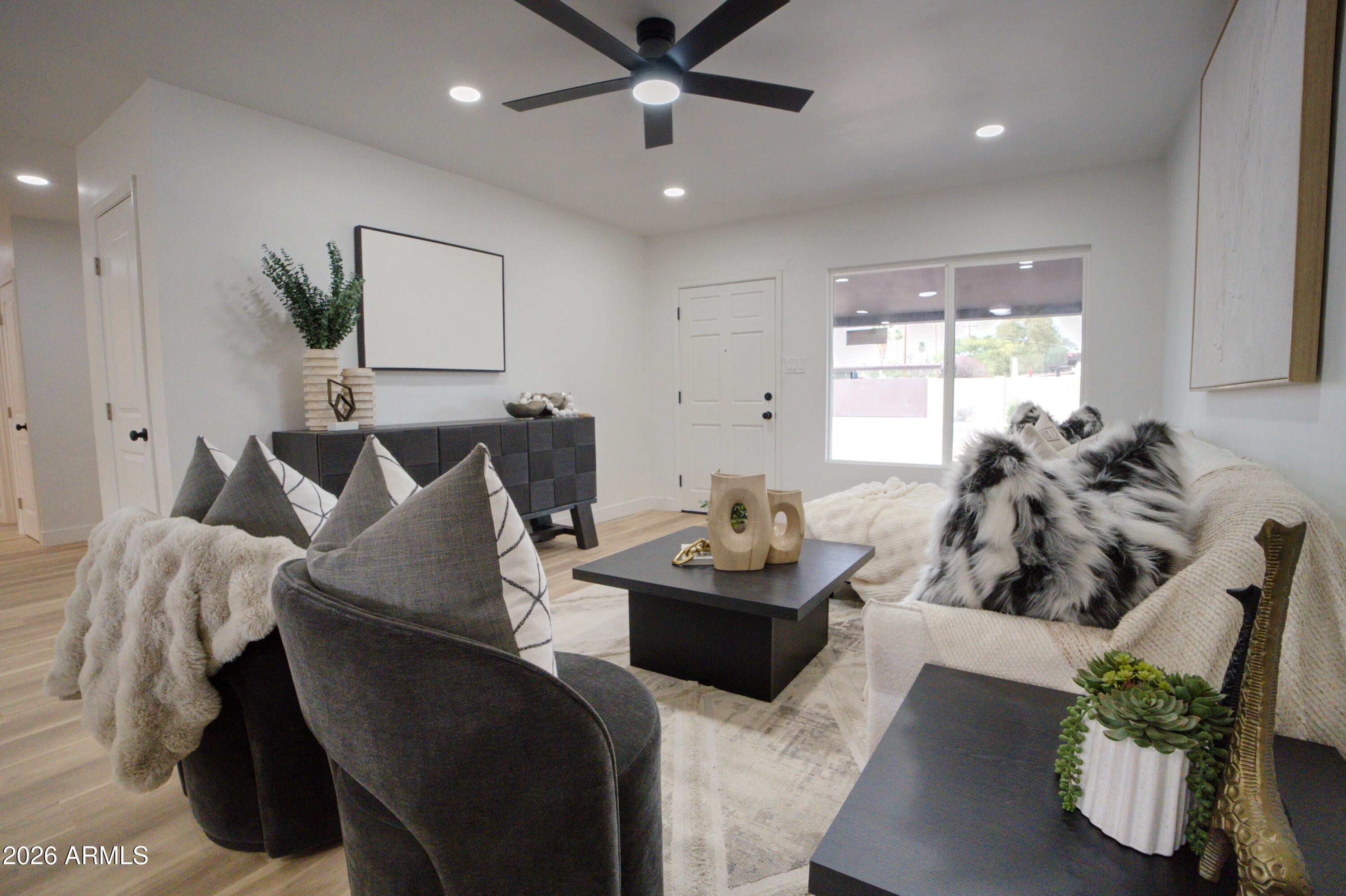 4437 East Almeria Road Phoenix, AZ 85008 - Photo 5 of 20 a living room with furniture and a large window