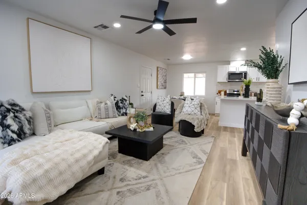 a living room with furniture and a fireplace