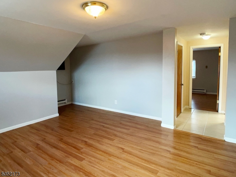 17 Gates Avenue, Unit 3 Montclair, NJ 07042 - Photo 4 of 10 a view of an empty room with wooden floor