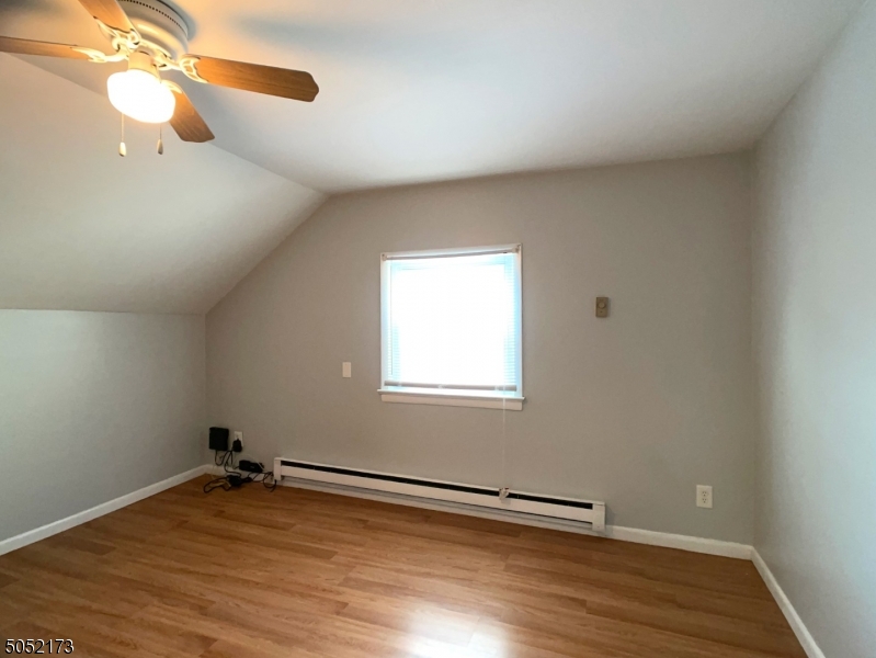 17 Gates Avenue, Unit 3 Montclair, NJ 07042 - Photo 7 of 10 a view of an empty room with wooden floor and a window