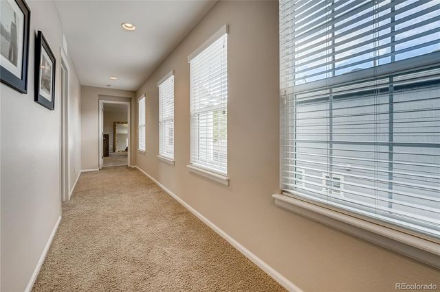 a view of hallway with windows