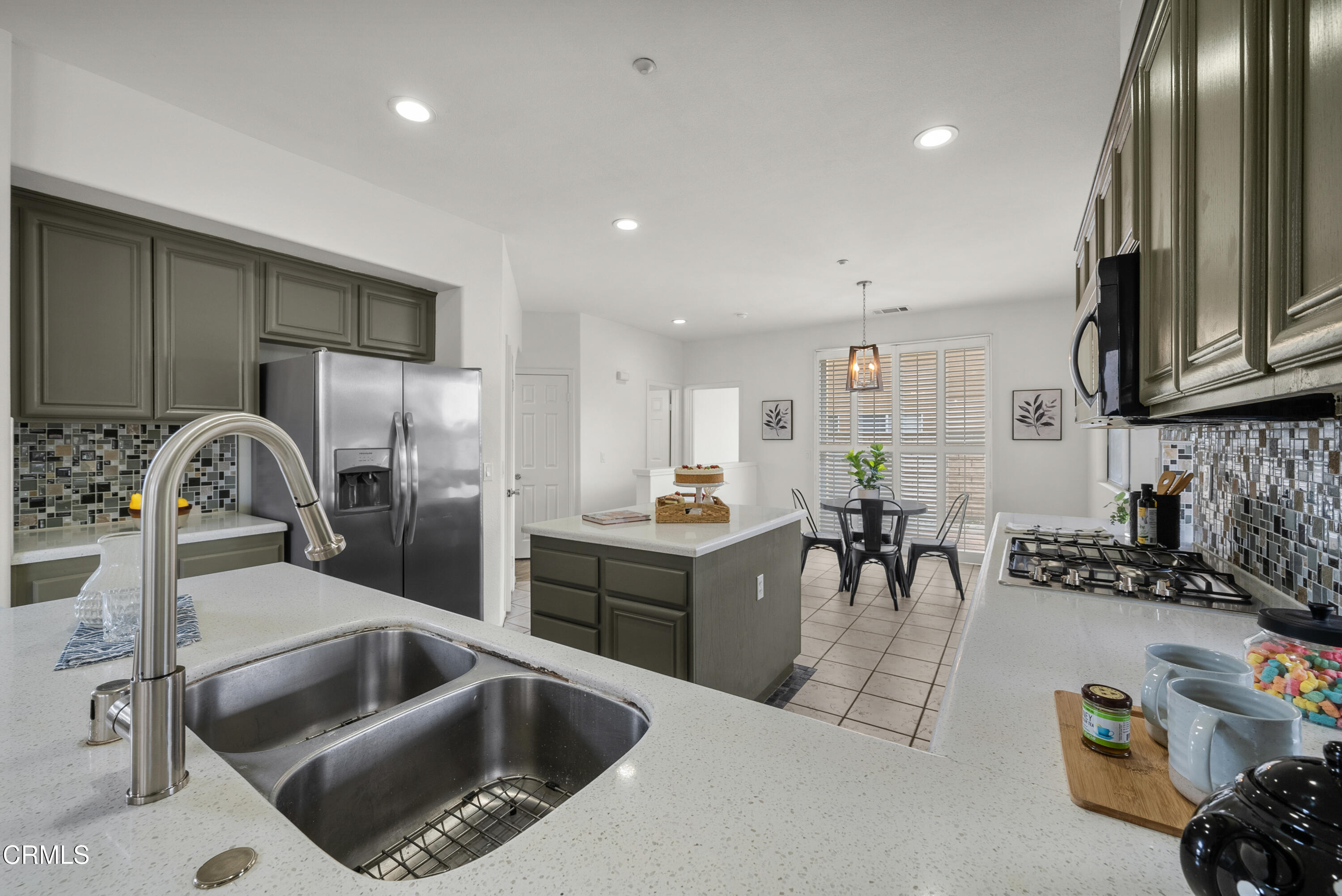 3543 Monte Carlo Drive Oxnard, CA 93035 - Photo 12 of 36 a kitchen with a sink cabinets and appliances