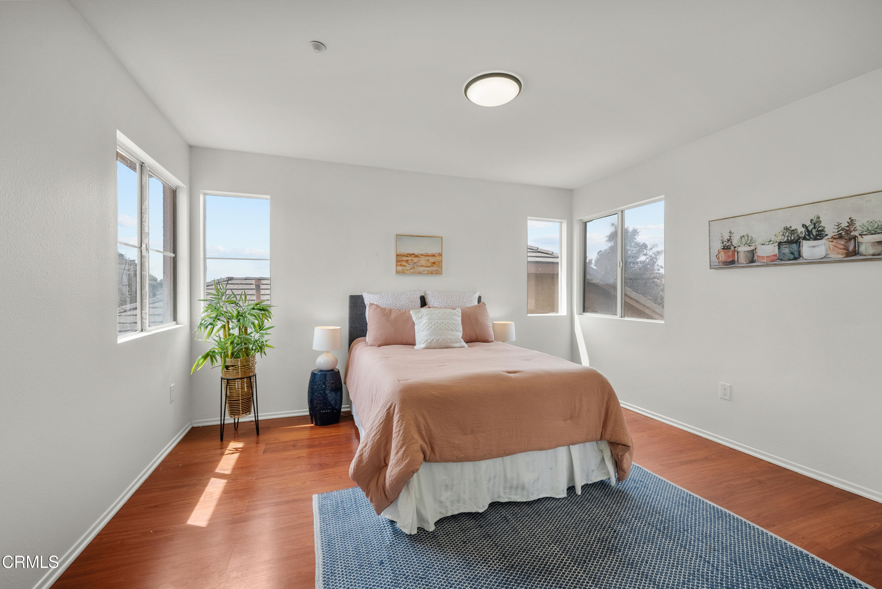 3543 Monte Carlo Drive Oxnard, CA 93035 - Photo 22 of 36 a room with a bed and wooden floor