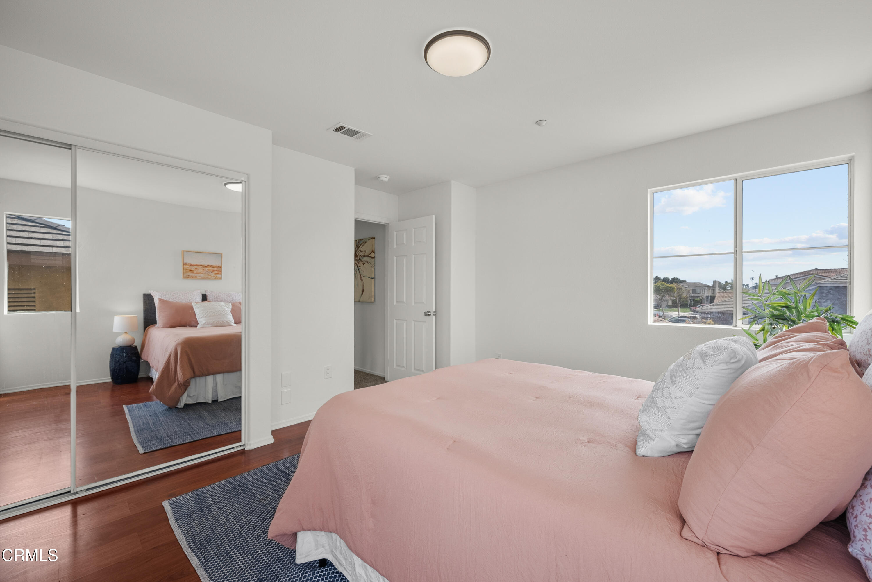 3543 Monte Carlo Drive Oxnard, CA 93035 - Photo 23 of 36 a bedroom with a large bed and a window