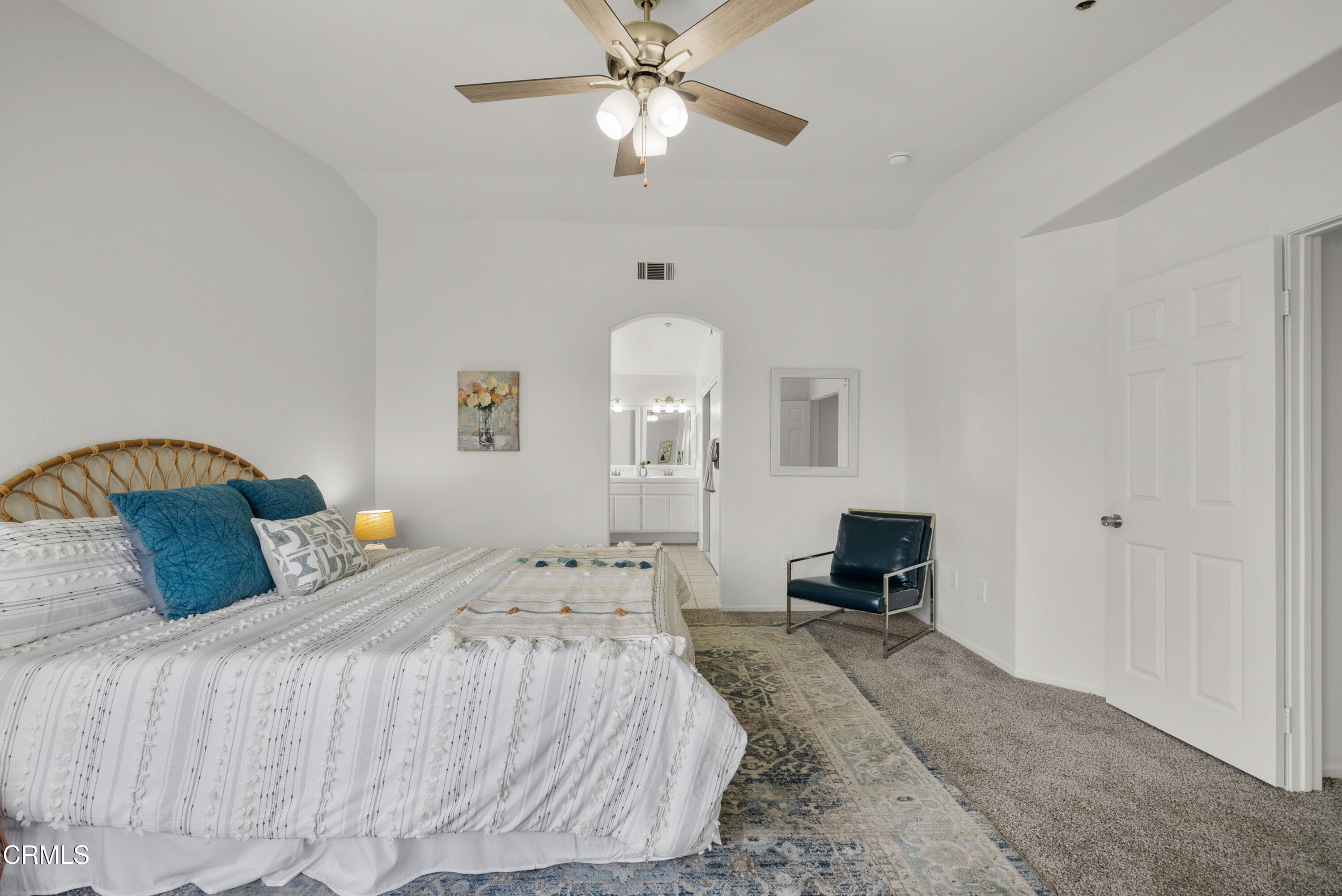 3543 Monte Carlo Drive Oxnard, CA 93035 - Photo 25 of 36 a bedroom with a bed and a chandelier