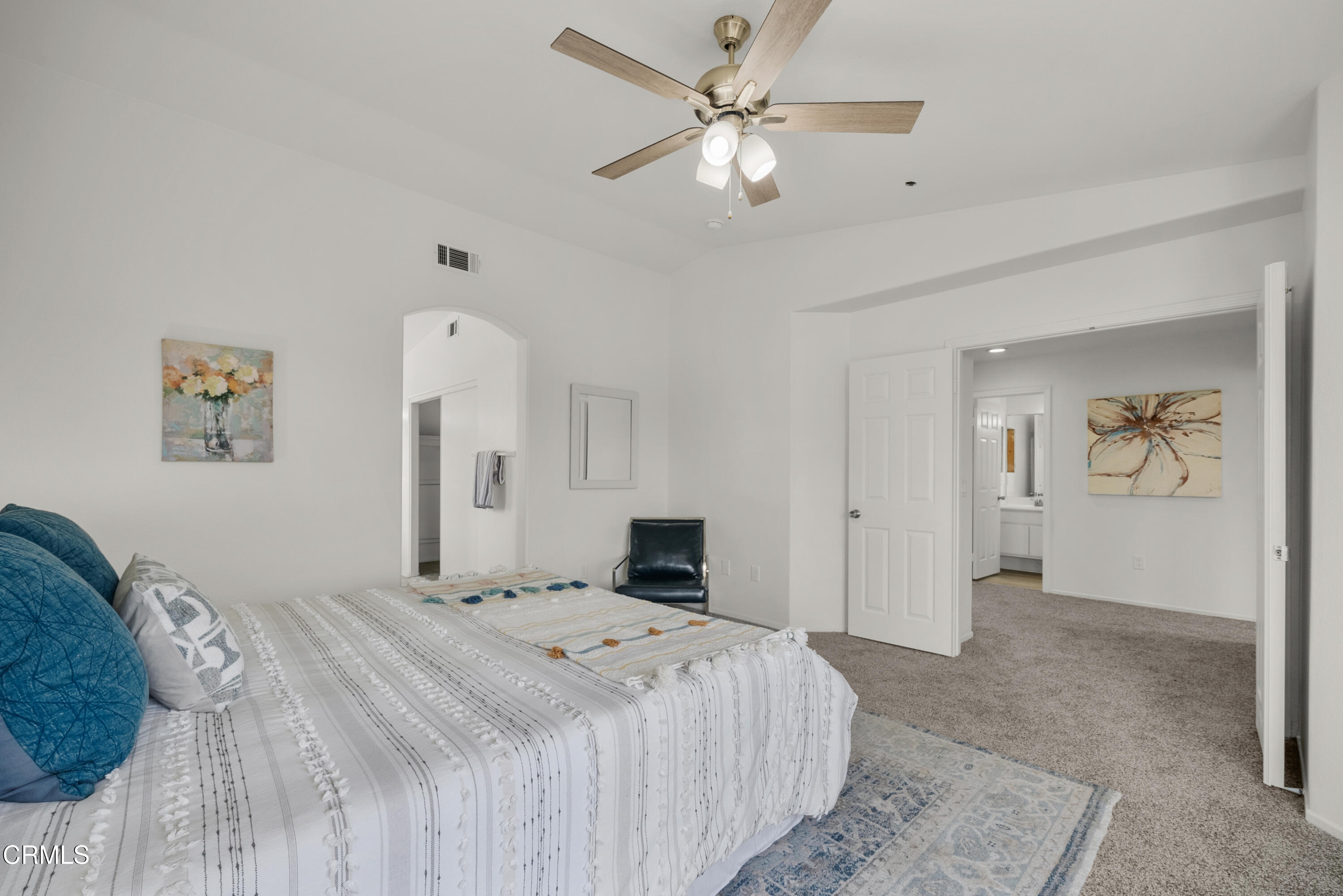 3543 Monte Carlo Drive Oxnard, CA 93035 - Photo 26 of 36 a bedroom with a large bed and a chandelier