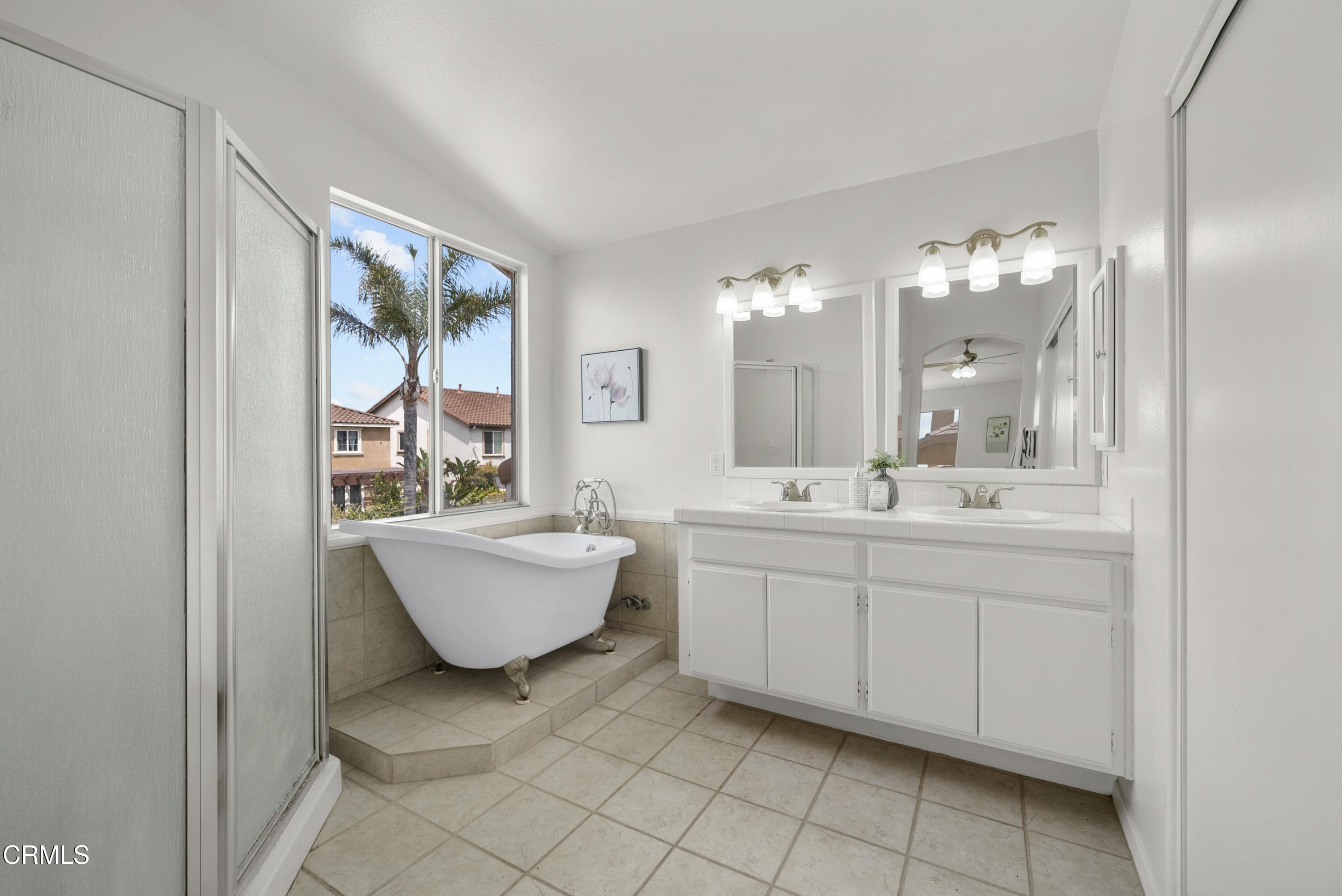 3543 Monte Carlo Drive Oxnard, CA 93035 - Photo 27 of 36 a bathroom with a double vanity sink mirror and bathtub