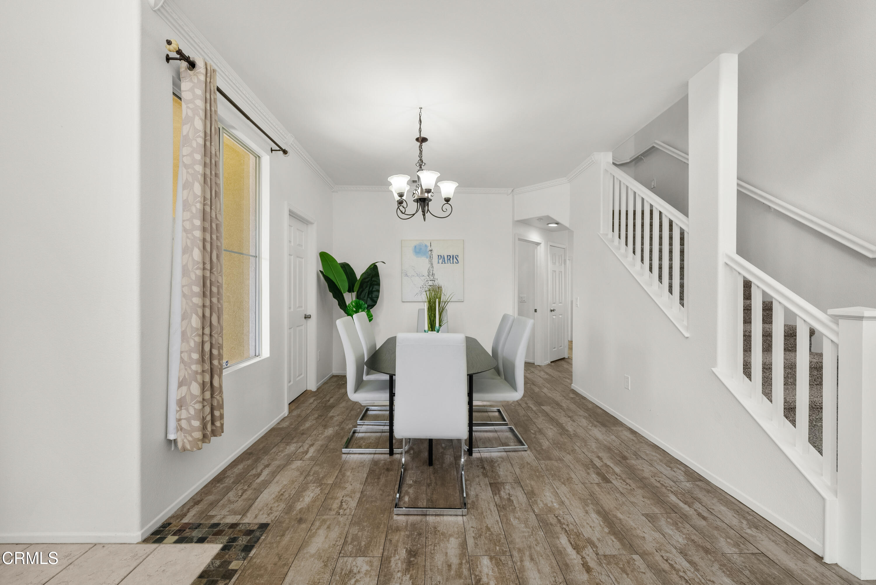 3543 Monte Carlo Drive Oxnard, CA 93035 - Photo 6 of 36 a dining room with furniture a chandelier and wooden floor