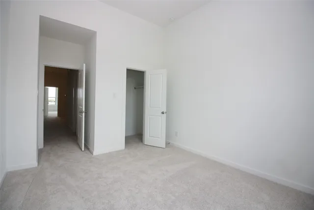 a view of an empty room and closet