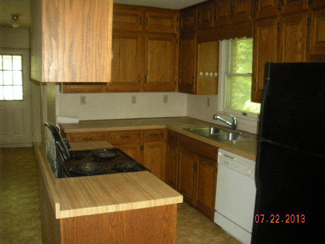 199 Towers Road Mount Solon, VA 22843 - Photo 6 of 16 a kitchen with a sink a stove and a refrigerator