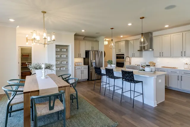 a view of a dining room kitchen and windows