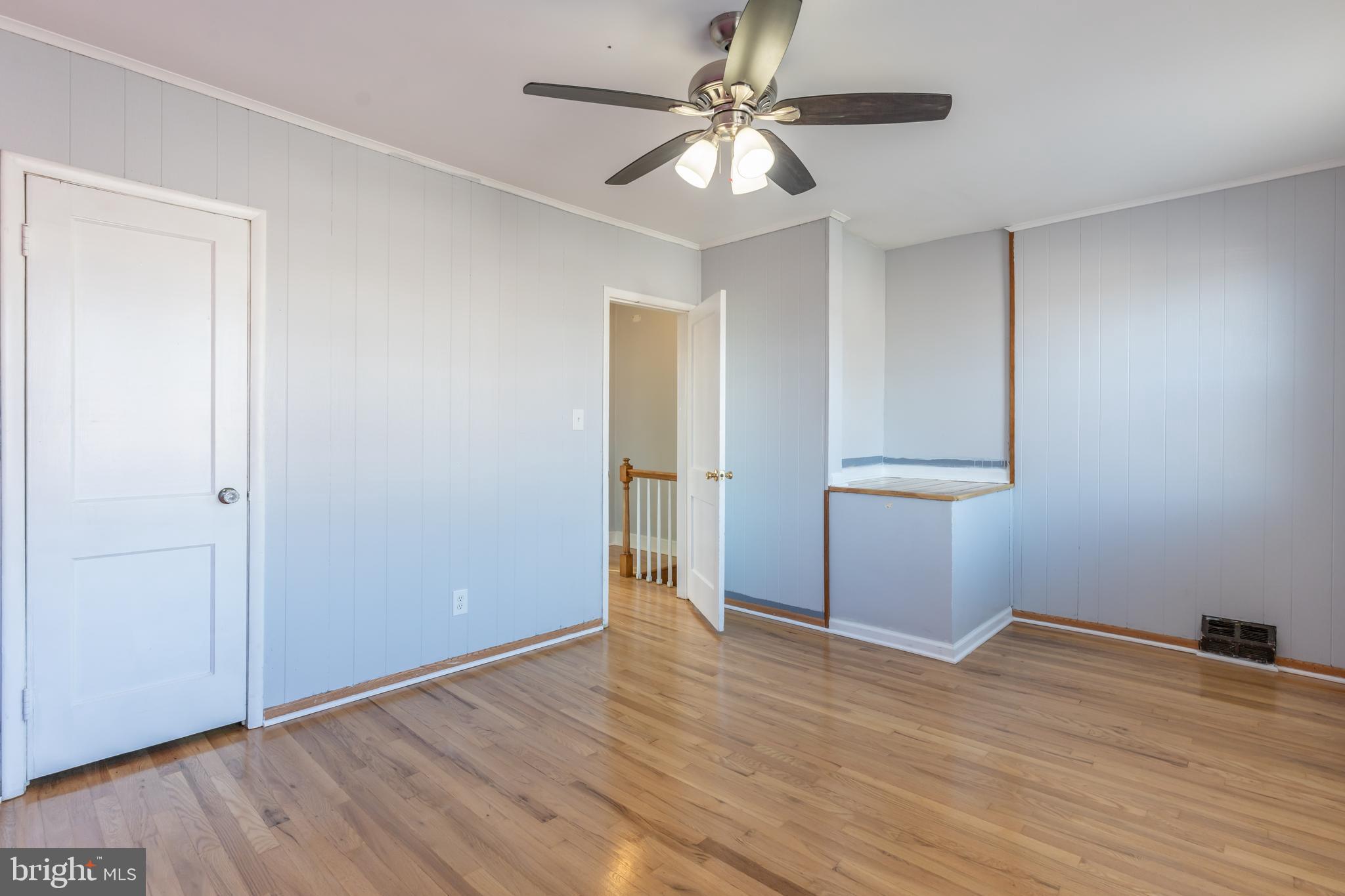 577 Welbrook Road Baltimore, MD 21221 - Photo 16 of 31 an empty room with wooden floor and windows