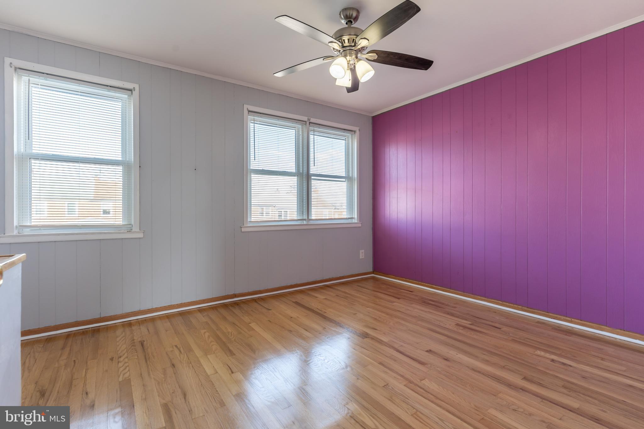 577 Welbrook Road Baltimore, MD 21221 - Photo 17 of 31 a view of empty room with wooden floor and fan