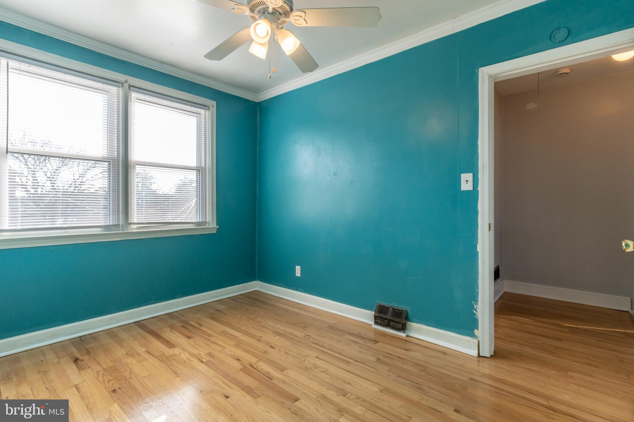 577 Welbrook Road Baltimore, MD 21221 - Photo 20 of 31 a view of empty room with wooden floor and fan