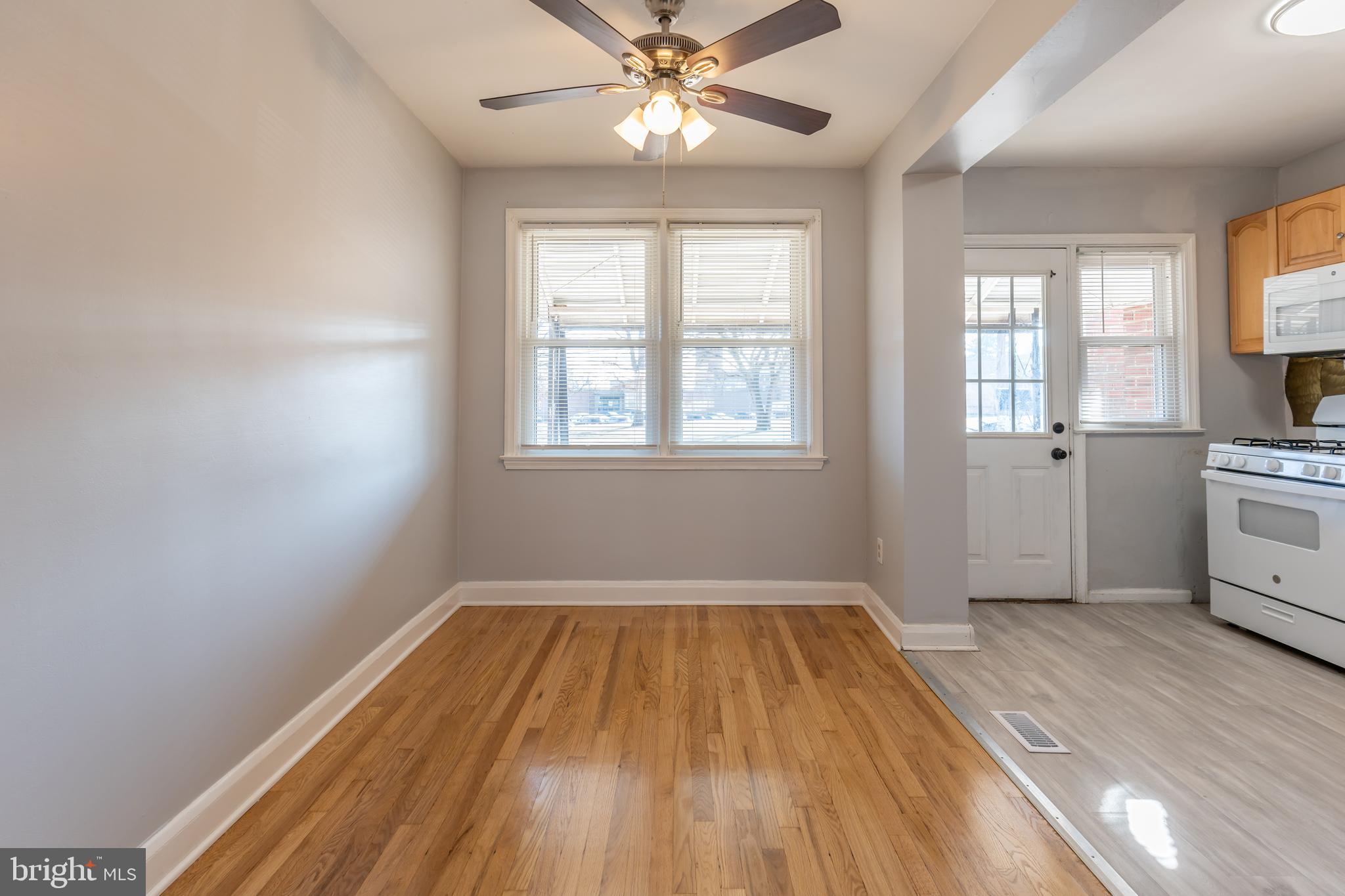 577 Welbrook Road Baltimore, MD 21221 - Photo 8 of 31 wooden floor in an empty room with a window