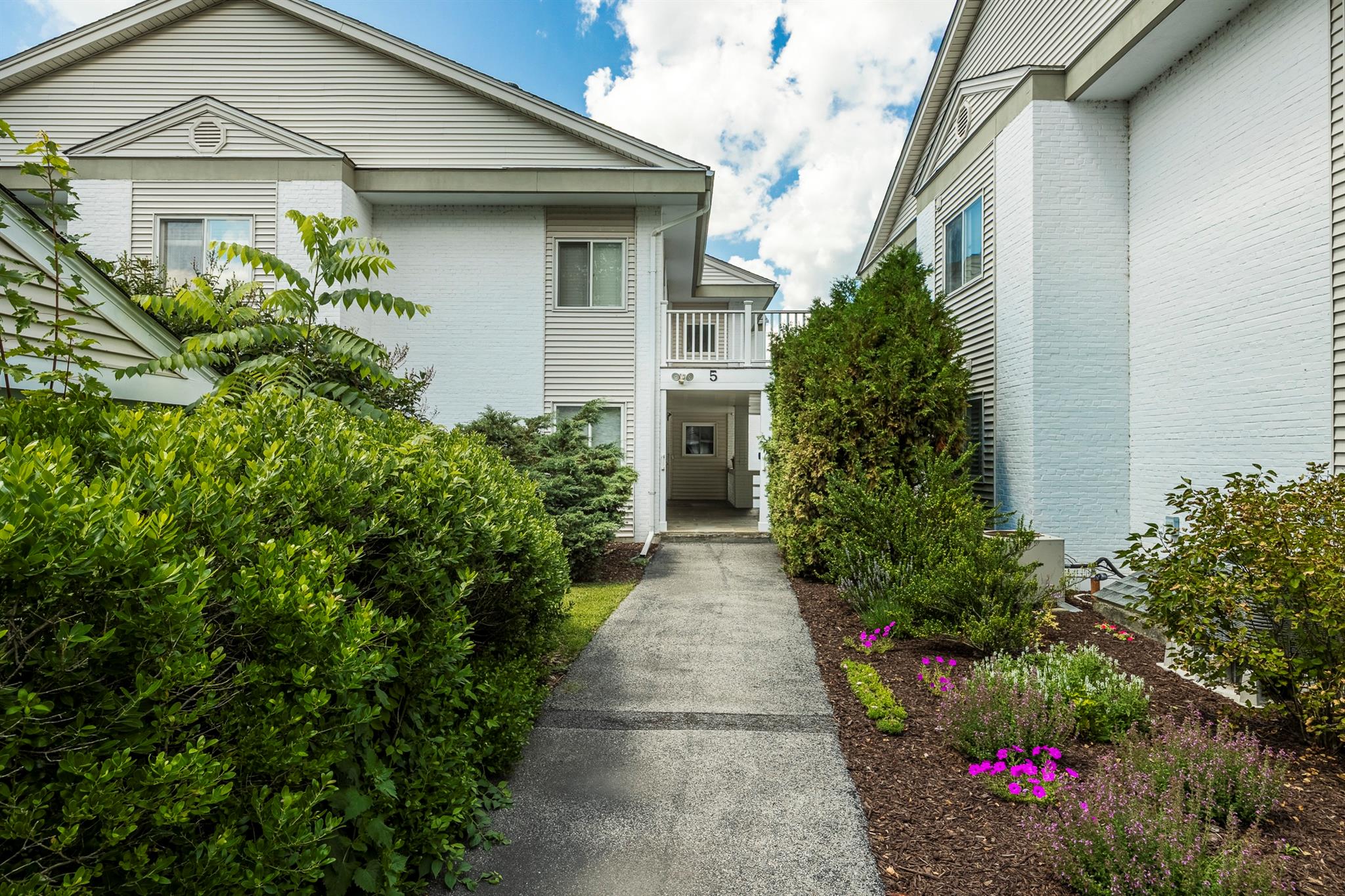 53 Bennett Common Way Millbrook, NY 12545 - Photo 1 of 1 a front view of a house with a yard