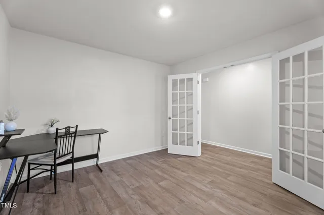 a view of kitchen island wooden floor and living room