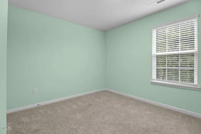 a bedroom with a bed a desk and chair