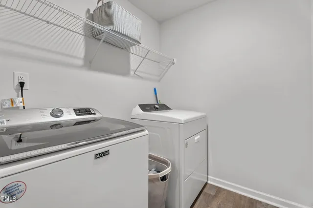 a bathroom with a double vanity sink toilet and a mirror