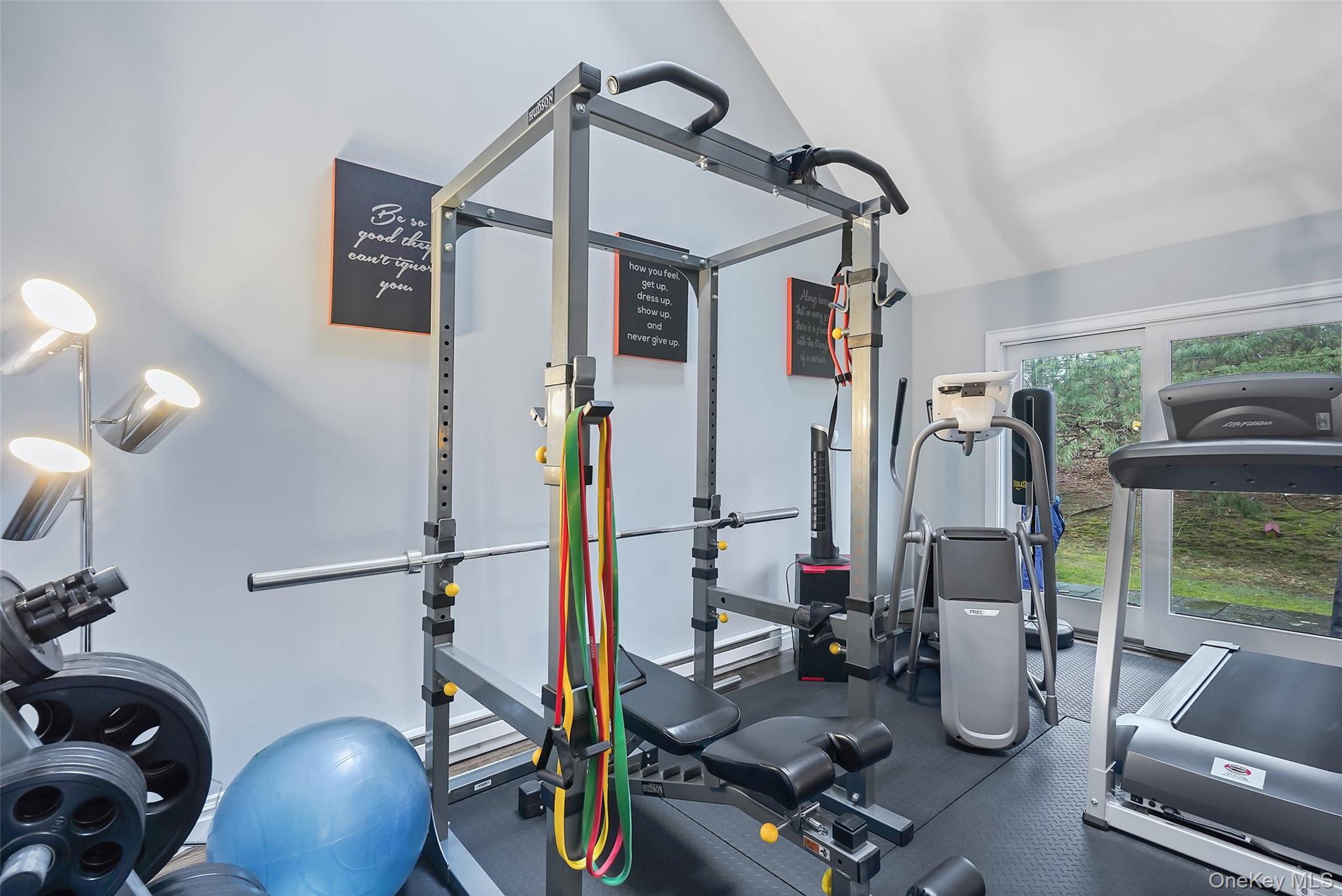 21 Croton Lake Road, Unit 6 Katonah, NY 10536 - Photo 15 of 31 Family Room with sliders to patio. Currently being used as a gym